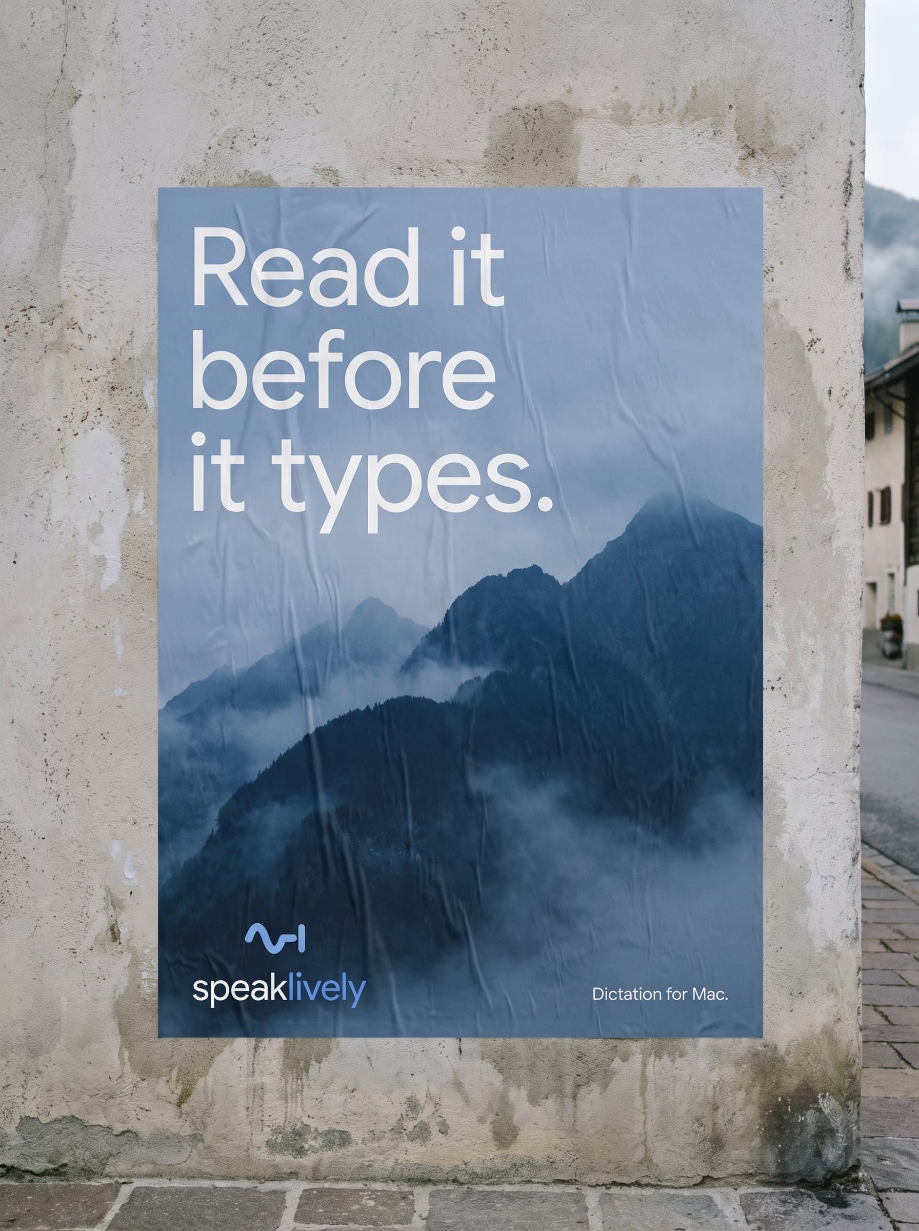 A “Read it before it types” poster pasted on a concrete wall in an alpine village